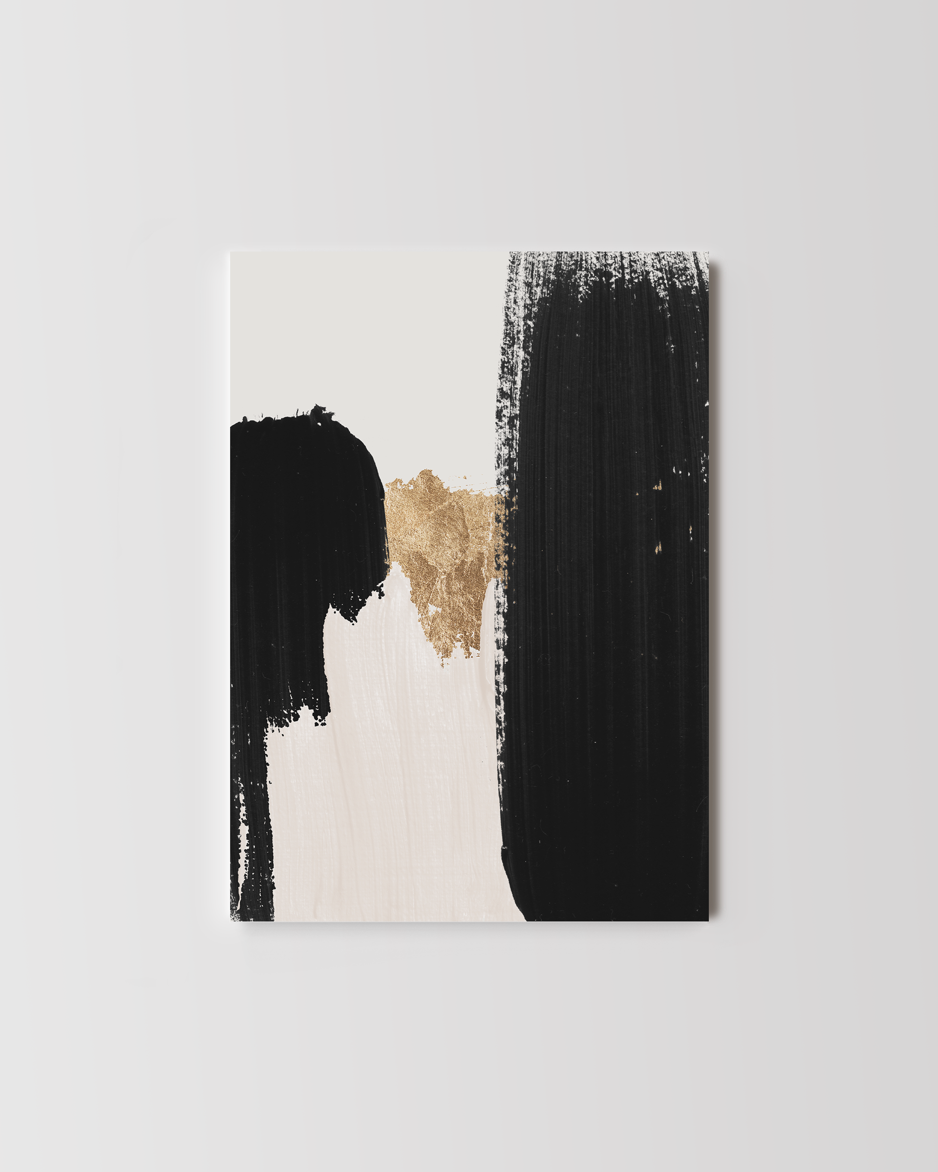 Abstract wall art featuring bold black brushstrokes and textured gold leaf accents.
