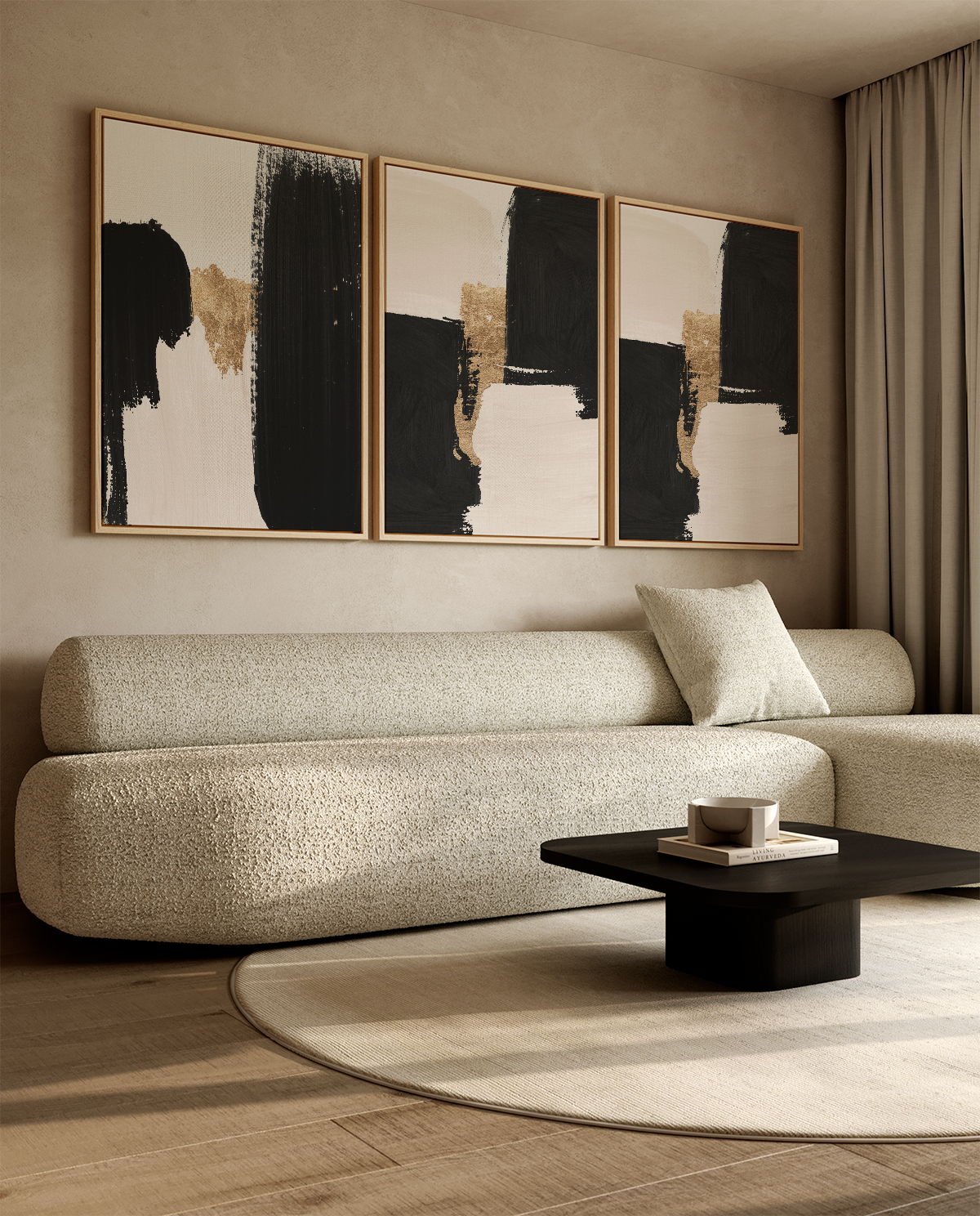 A modern living room featuring a three-panel abstract wall art set with black, beige, and gold brushstrokes in thin gold frames, hung above a textured beige boucle sofa.