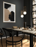 Abstract gold sprinkle wall art featuring a refined scattered pattern