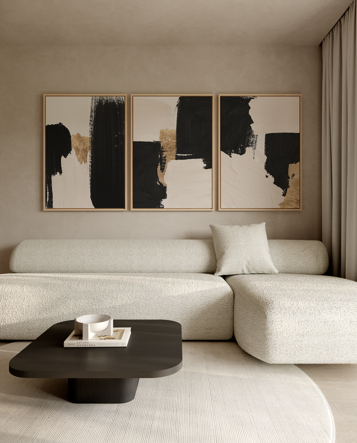 A modern living room featuring a three-panel abstract wall art set with black, beige, and white brushstrokes in light wood frames.