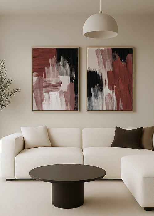 Modern living room with a white sofa, abstract burgundy art on the wall, and a black coffee table.