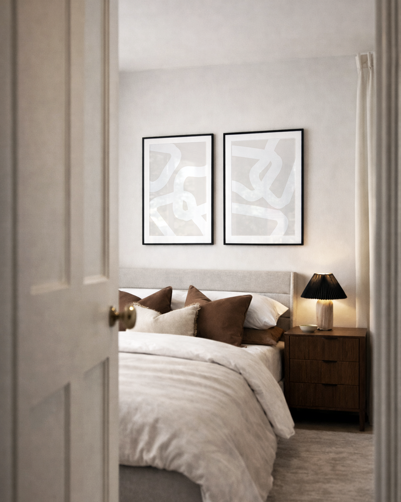 Modern bedroom with abstract lines wall art, bed, and nightstand.