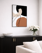 Abstract burnt orange wall art in modern black and beige livingroom