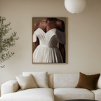 Modern wall art of a black woman in a white dress on a wall in a contemporary living room.