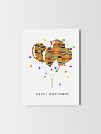 African-inspired birthday greeting card featuring a vibrant kente pattern design