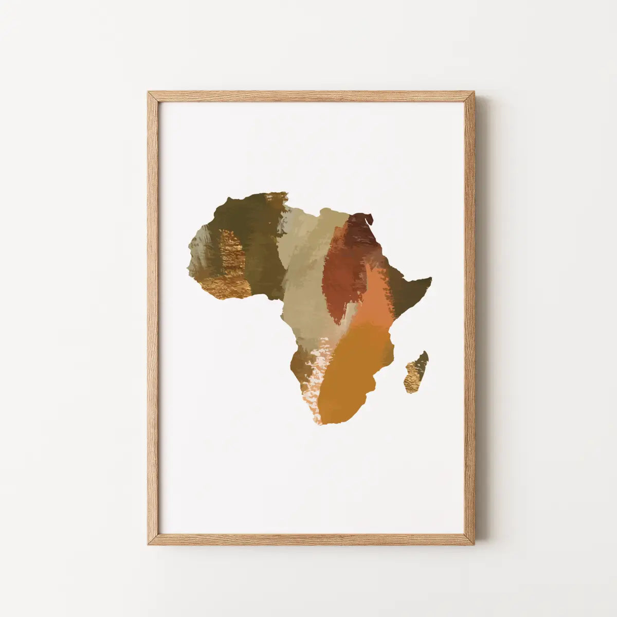 Framed wall art featuring an abstract map of Africa in earthy tones of brown, gold, beige, and rust on a white background, set in a light natural wood frame.