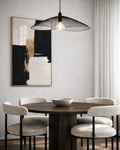 abstract gold and black artwork in a modern dining room