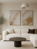 Modern living room with a white sofa and gold abstract wall art set