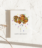 Minimal birthday greeting card featuring clean text and a simple festive style