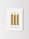 Birthday greeting card with illustrated candles decorated in colourful kente patterns