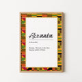 A framed wall art print featuring the word 'Akwaaba' with a colorful African Kente-style pattern border, shown hanging on a plain light wall.