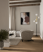 Minimal interior scene featuring framed abstract wall art arranged on a neutral wall