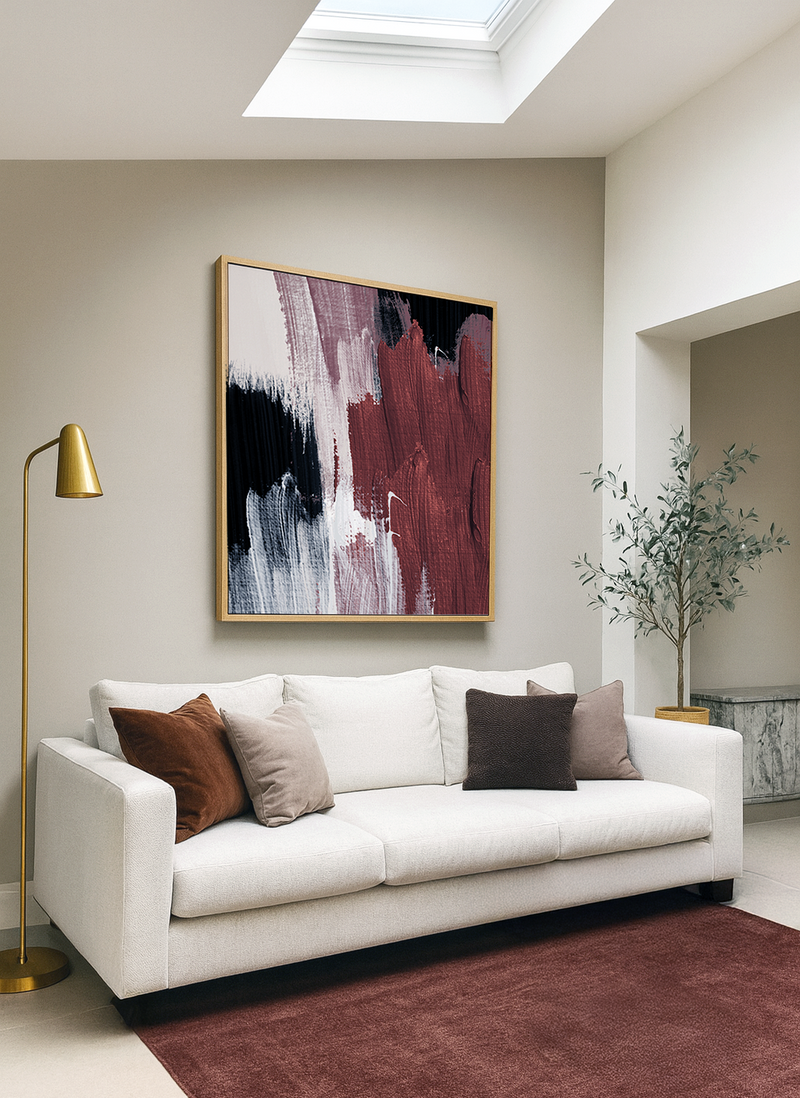 Modern living room with a white sofa and Abstract strokes burgundy wall art