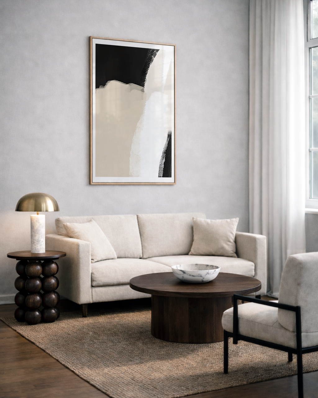 Modern living room with a beige sofa, round wooden coffee table, and neutral beige abstract wall art on the wall.