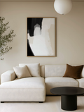 Neutral wall art with beige and black accents in a modern living room