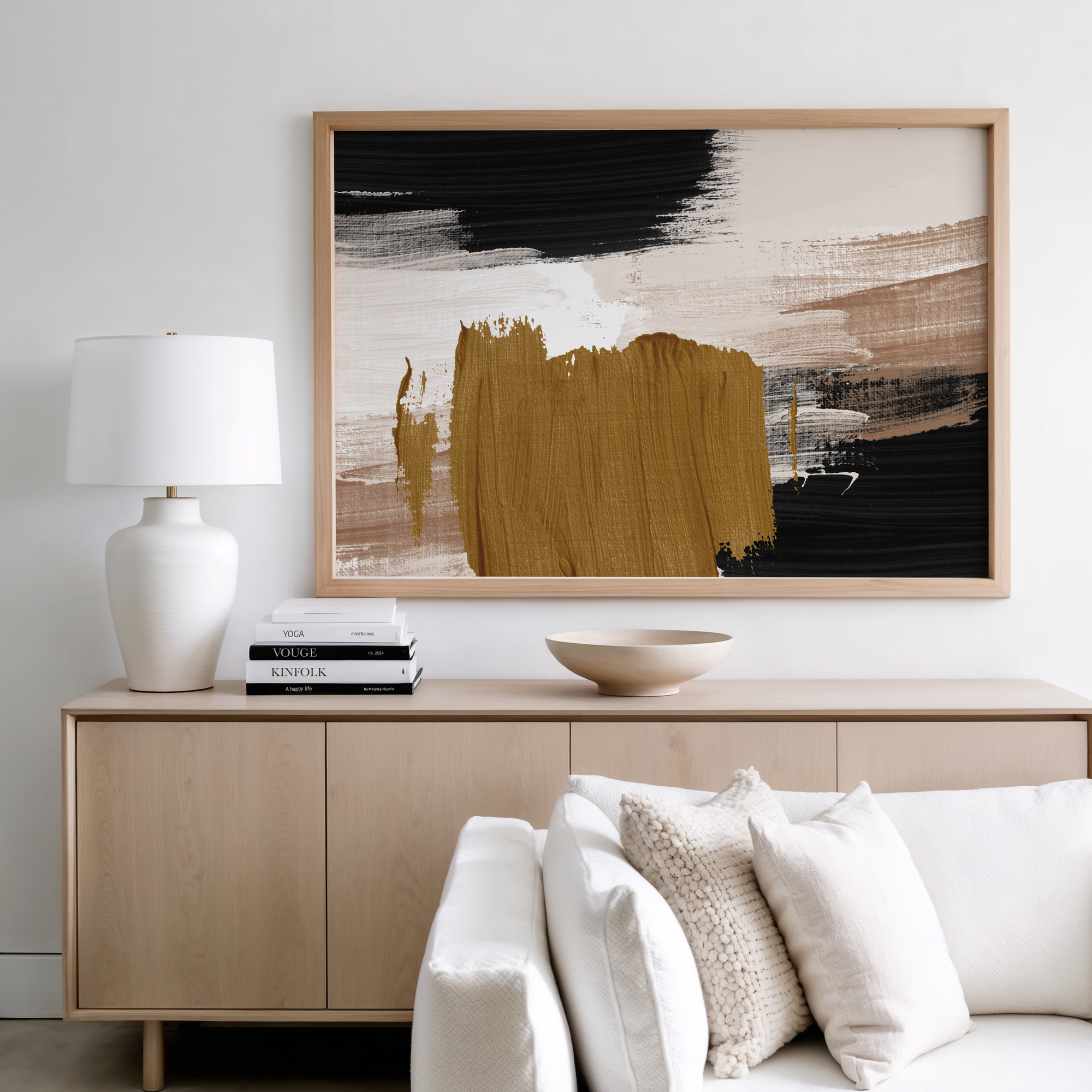 Modern living room with a wooden sideboard, abstract painting, and white sofa.