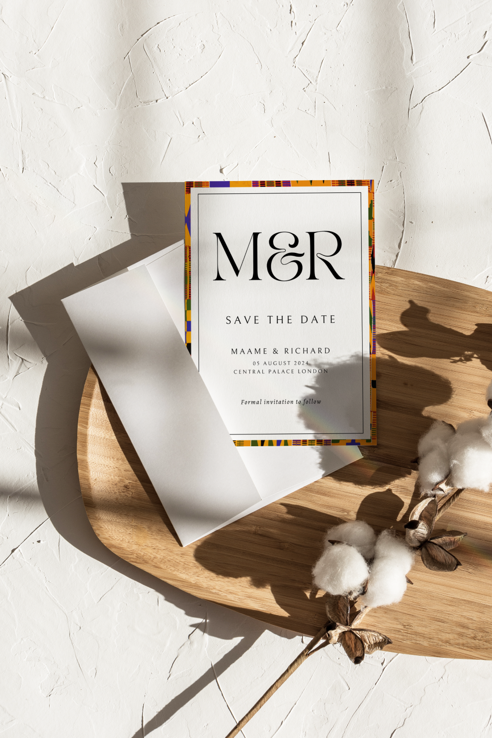 Save the date wedding card showcasing kente-inspired elements in a refined design