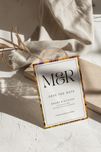 Alternate save the date wedding card featuring kente details and clean typography