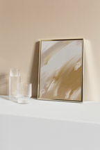 Warm minimal interior styling scene with framed wall art displayed together